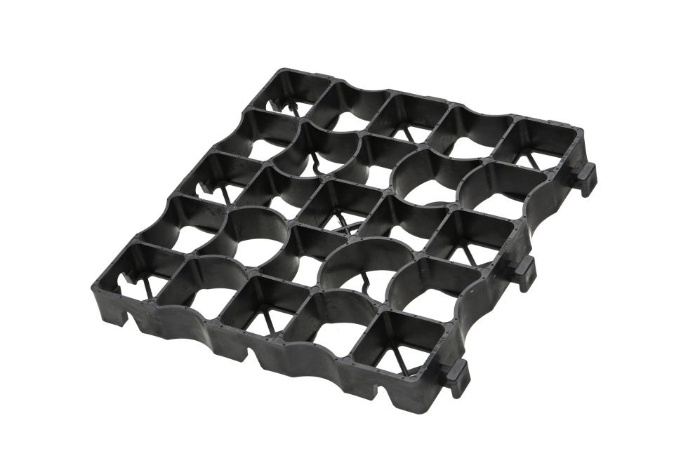 Ein Ecken eines grauen Kunststoffecorasters, untereinander verbindbar an Zäpfchen